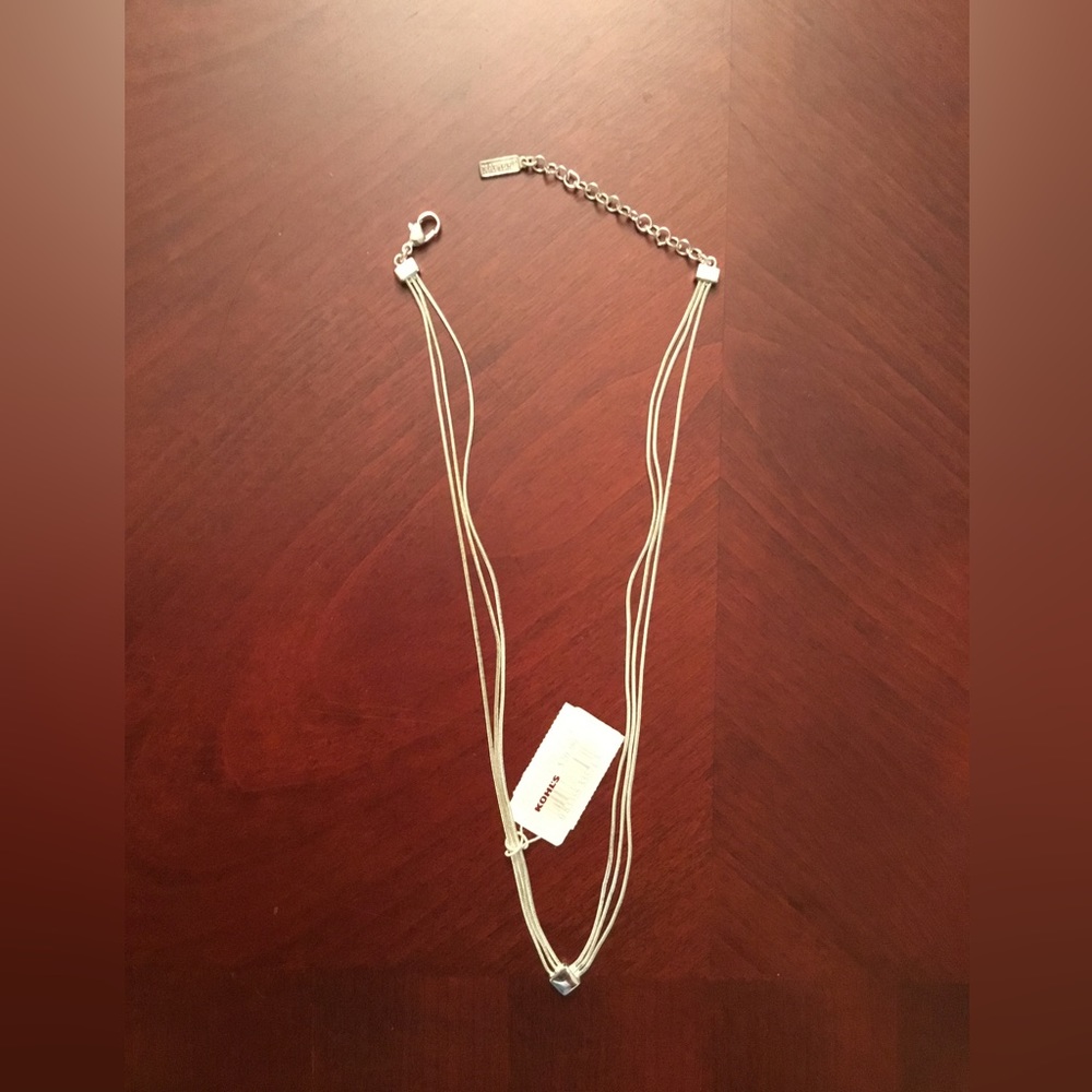 NWT Necklace Silver tone 3 row snake chain with fixed diamond shape in center.